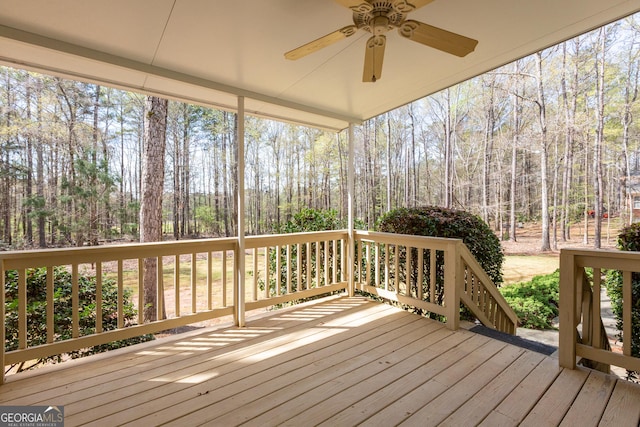 115 Flagstop Run, Fayetteville, GA 30215 - deck with a ceiling fan and view of wooded area