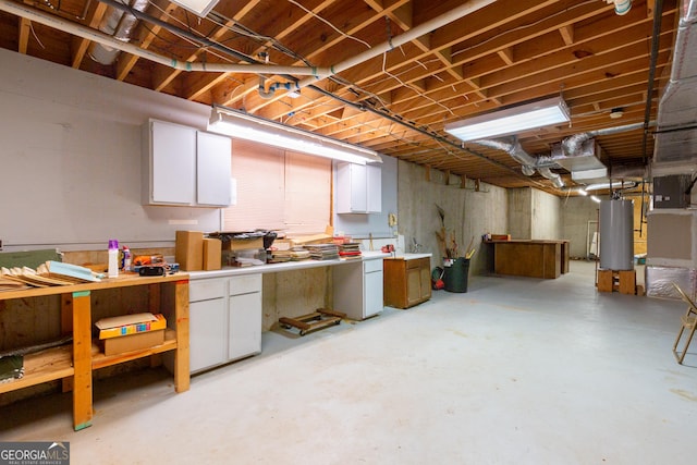 115 Flagstop Run, Fayetteville, GA 30215 - unfinished basement featuring gas water heater and a workshop area