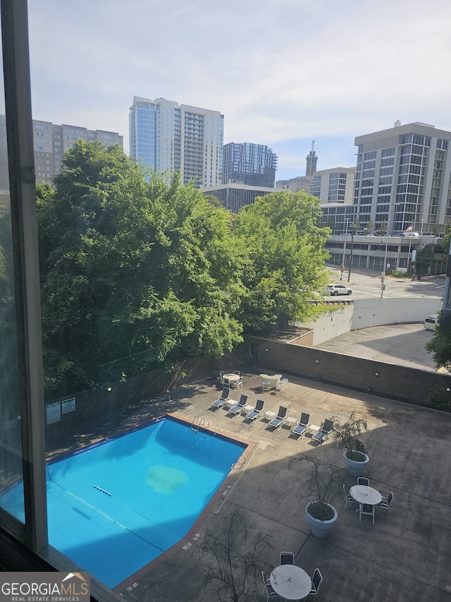 215 Piedmont Ave NE Unit 304, Atlanta, GA 30308 - pool featuring a city view and a patio area