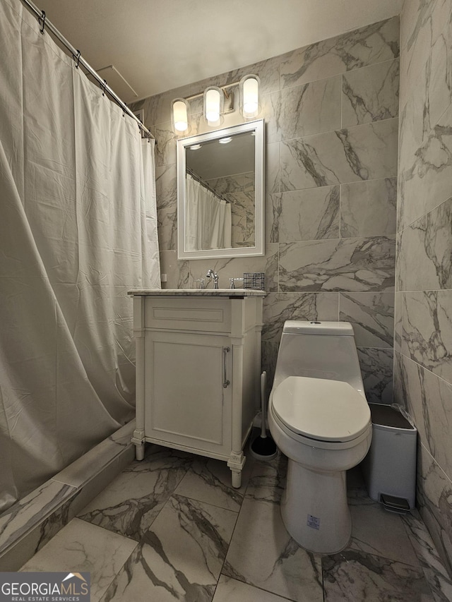 215 Piedmont Ave NE Unit 304, Atlanta, GA 30308 - bathroom with marble finish floor, curtained shower, vanity, and toilet