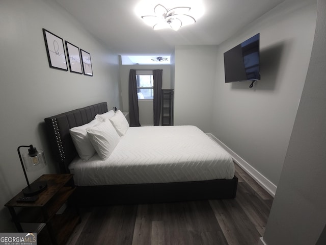 215 Piedmont Ave NE Unit 304, Atlanta, GA 30308 - bedroom featuring baseboards and dark wood-type flooring