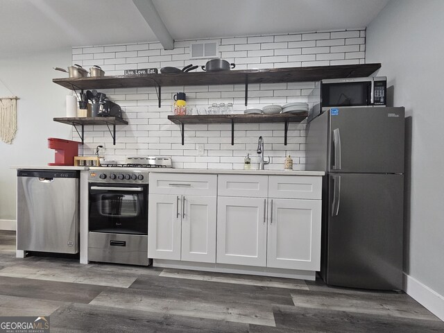 215 Piedmont Ave NE Unit 304, Atlanta, GA 30308 - kitchen with open shelves, visible vents, tasteful backsplash, appliances with stainless steel finishes, and white cabinetry
