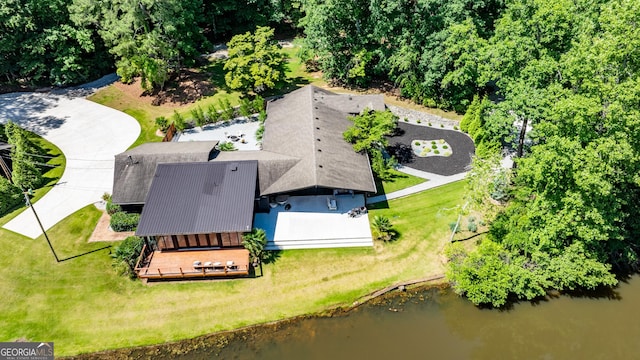 birds eye view of property with a water view