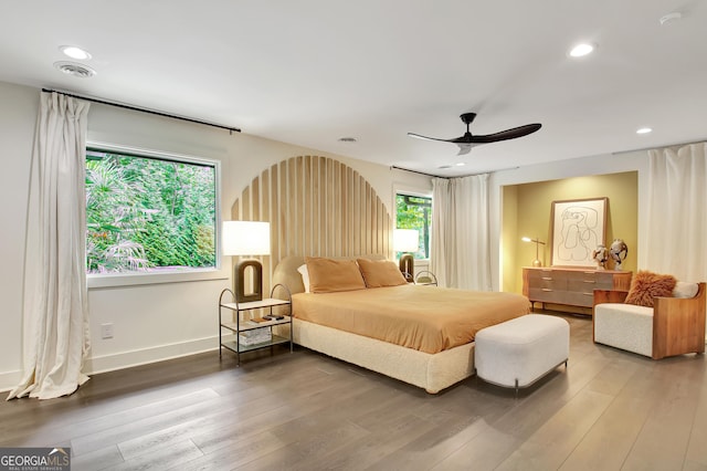 bedroom featuring recessed lighting, light wood-type flooring, baseboards, visible vents, and ceiling fan