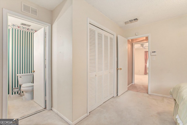 corridor with baseboards, carpet flooring, and visible vents