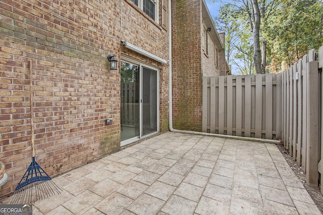 view of patio featuring fence