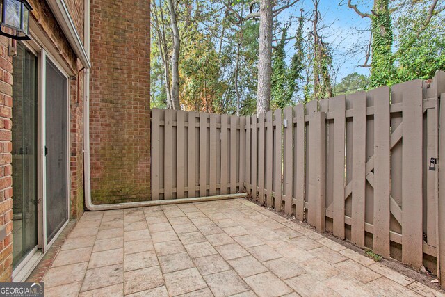 view of patio / terrace featuring fence