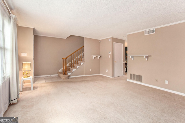 unfurnished living room with stairs, carpet flooring, baseboards, a textured ceiling, and visible vents