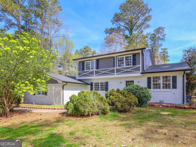 1749 Lauranceae Way, Riverdale, GA 30296 - view of front facade featuring board and batten siding, brick siding, and a front lawn