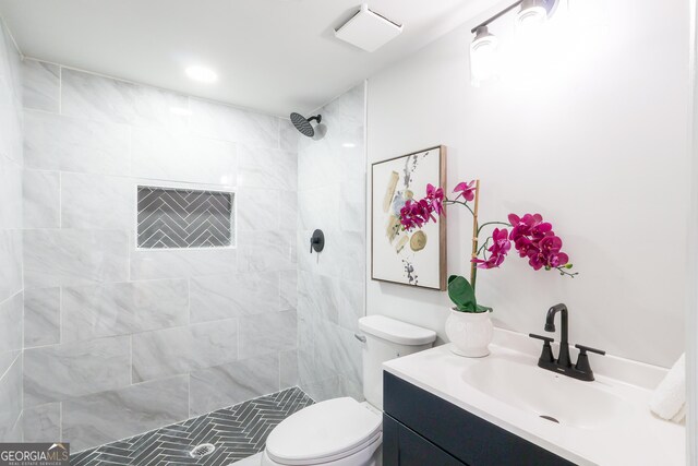 1749 Lauranceae Way, Riverdale, GA 30296 - bathroom featuring toilet, vanity, and tiled shower