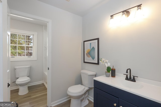 1749 Lauranceae Way, Riverdale, GA 30296 - full bathroom featuring toilet, vanity, baseboards, and wood finished floors