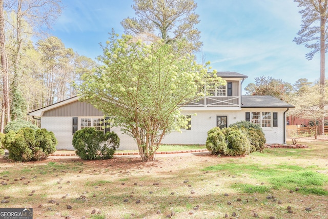 1749 Lauranceae Way, Riverdale, GA 30296 - view of front of house with brick siding, board and batten siding, and a front yard