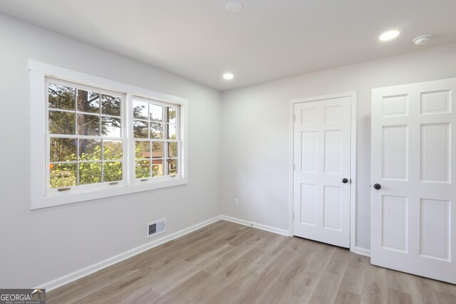 1749 Lauranceae Way, Riverdale, GA 30296 - unfurnished bedroom featuring baseboards, recessed lighting, visible vents, and light wood-style floors