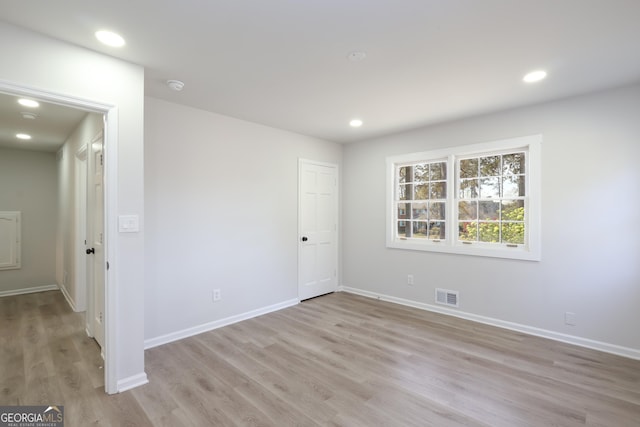 1749 Lauranceae Way, Riverdale, GA 30296 - unfurnished bedroom with recessed lighting, baseboards, light wood finished floors, and visible vents