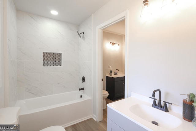 1749 Lauranceae Way, Riverdale, GA 30296 - bathroom featuring toilet, vanity,  shower combination, and wood finished floors