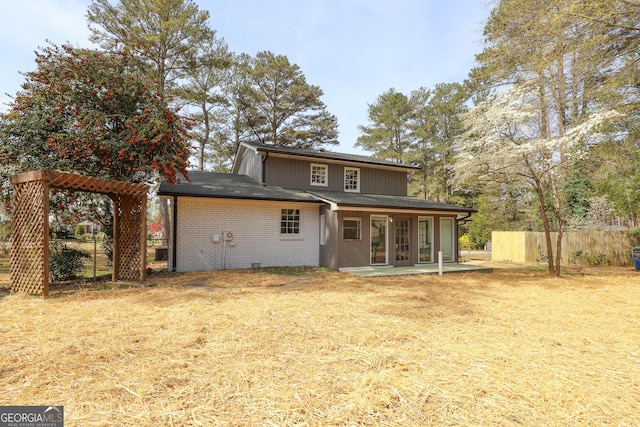 1749 Lauranceae Way, Riverdale, GA 30296 - rear view of property with brick siding, fence, and a patio area