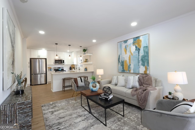 1749 Lauranceae Way, Riverdale, GA 30296 - living area featuring recessed lighting, crown molding, and light wood-type flooring