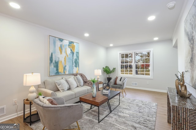 1749 Lauranceae Way, Riverdale, GA 30296 - living area featuring visible vents, crown molding, and wood finished floors
