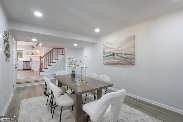 1749 Lauranceae Way, Riverdale, GA 30296 - dining space with baseboards, recessed lighting, wood finished floors, and stairway