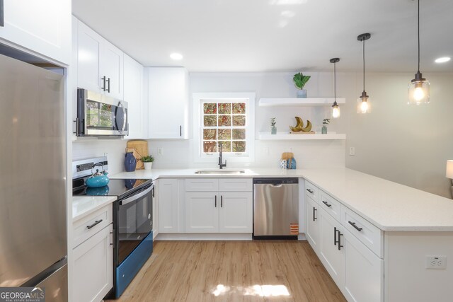 1749 Lauranceae Way, Riverdale, GA 30296 - kitchen featuring a sink, light countertops, appliances with stainless steel finishes, and a peninsula