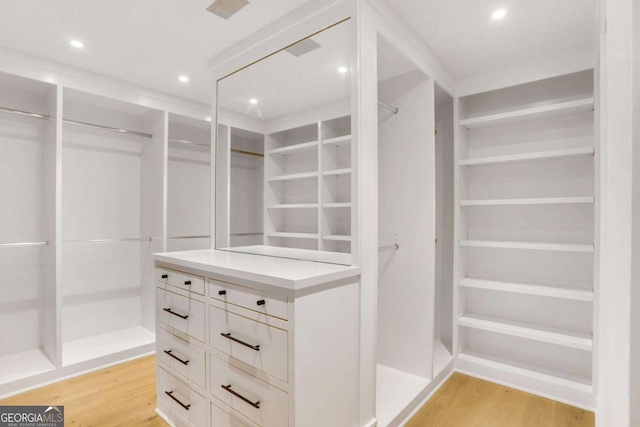 1718 Barnesdale Way NE, Atlanta, GA 30309 - walk in closet featuring light wood-type flooring