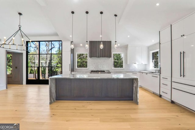 1718 Barnesdale Way NE, Atlanta, GA 30309 - kitchen with modern cabinets, extractor fan, white cabinetry, a large island, and recessed lighting