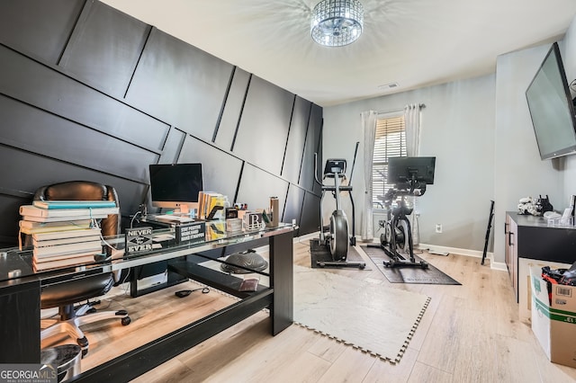 home office featuring baseboards, visible vents, and light wood-style flooring
