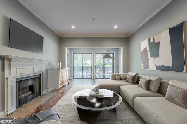 2921 Lenox Rd NE Unit 113, Atlanta, GA 30324 - living room with ornamental molding, wood finished floors, recessed lighting, and a fireplace with flush hearth