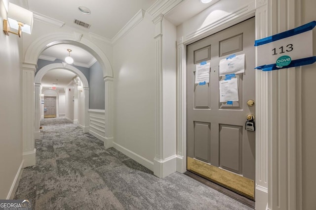 2921 Lenox Rd NE Unit 113, Atlanta, GA 30324 - foyer with carpet flooring, arched walkways, and crown molding