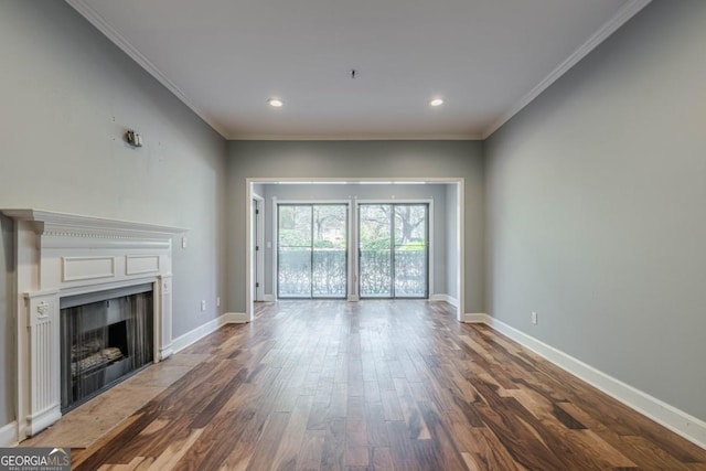 2921 Lenox Rd NE Unit 113, Atlanta, GA 30324 - unfurnished living room featuring wood finished floors, a fireplace with flush hearth, crown molding, and recessed lighting