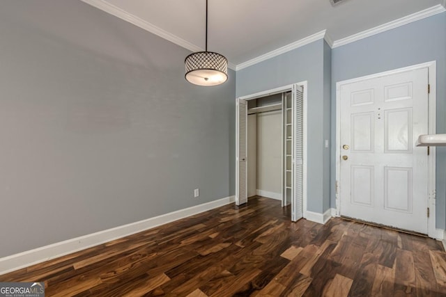2921 Lenox Rd NE Unit 113, Atlanta, GA 30324 - unfurnished bedroom with crown molding, dark wood-style flooring, and a closet