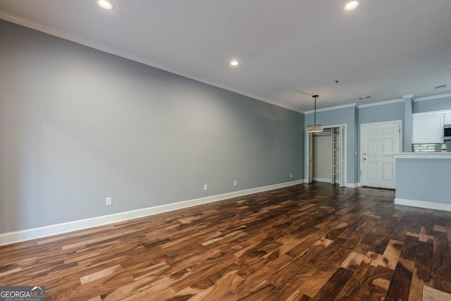 2921 Lenox Rd NE Unit 113, Atlanta, GA 30324 - unfurnished living room featuring dark wood finished floors, crown molding, and recessed lighting