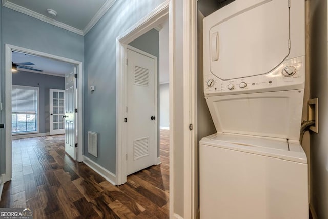 2921 Lenox Rd NE Unit 113, Atlanta, GA 30324 - laundry area with estacked washer and dryer, dark wood-style flooring, ornamental molding, and ceiling fan