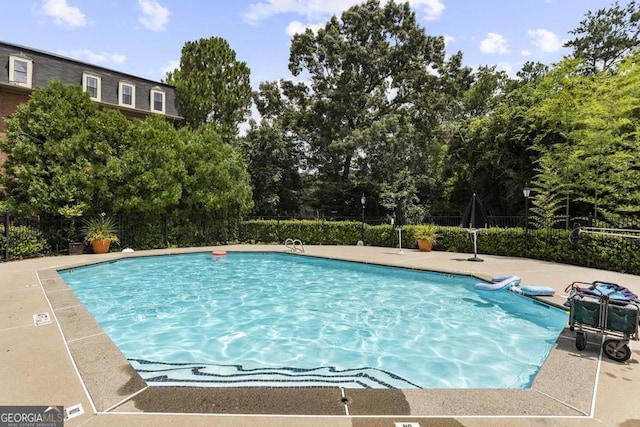 2921 Lenox Rd NE Unit 113, Atlanta, GA 30324 - community pool featuring view of wooded area