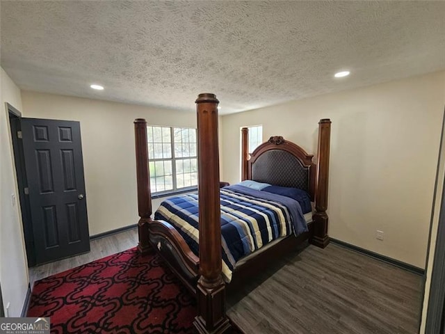 2565 Cloud, Decatur, GA 30034 - bedroom featuring wood finished floors, a textured ceiling, baseboards, and recessed lighting