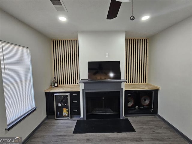 2565 Cloud, Decatur, GA 30034 - living room with wood finished floors, baseboards, a fireplace with flush hearth, wine cooler, and ceiling fan