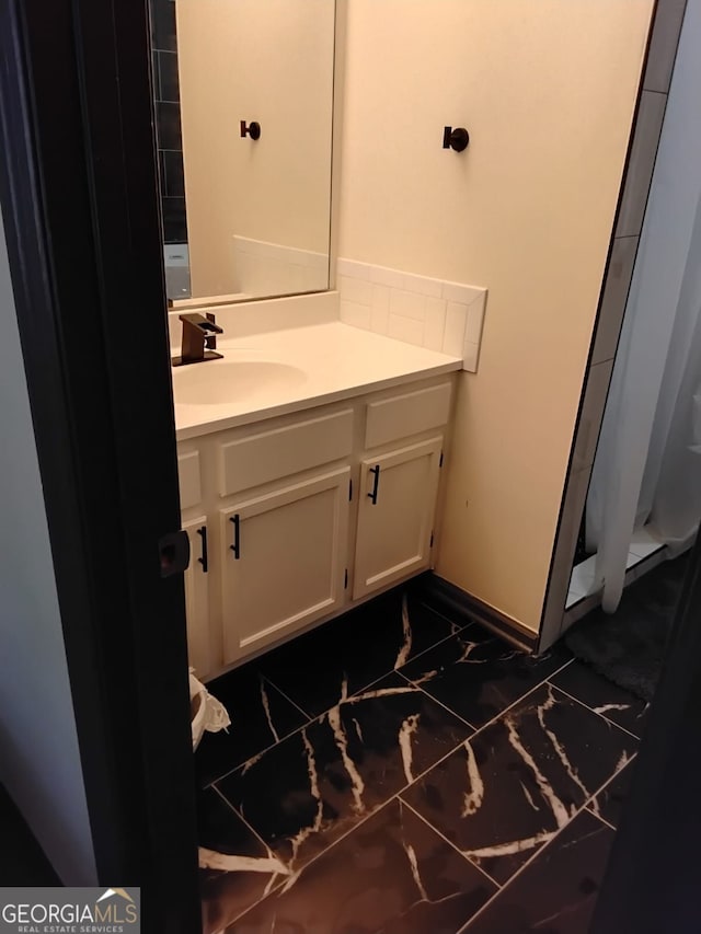 2565 Cloud, Decatur, GA 30034 - full bathroom featuring marble finish floors, vanity, curtained shower, and baseboards