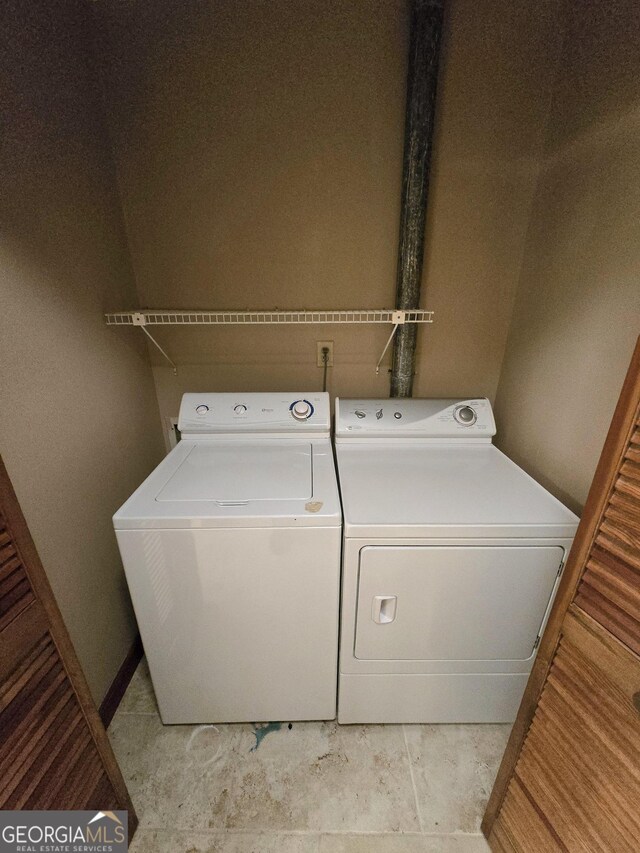 washroom featuring independent washer and dryer and laundry area
