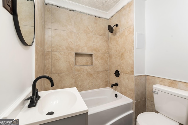 full bathroom featuring vanity, tile walls, toilet, a textured ceiling, and shower / bathtub combination