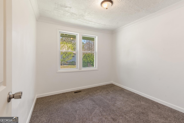 carpeted spare room featuring baseboards, visible vents, crown molding, and a textured ceiling