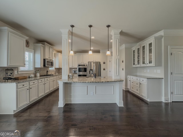 kitchen featuring white cabinetry, appliances with stainless steel finishes, dark wood finished floors, and glass insert cabinets