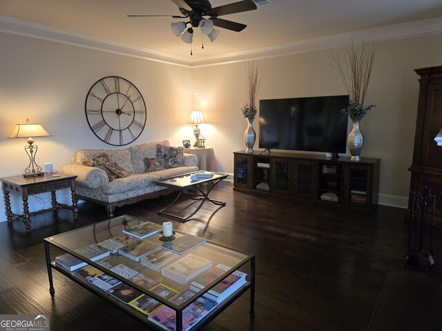 living area with crown molding, a ceiling fan, baseboards, and wood finished floors