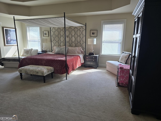 bedroom with carpet flooring and baseboards