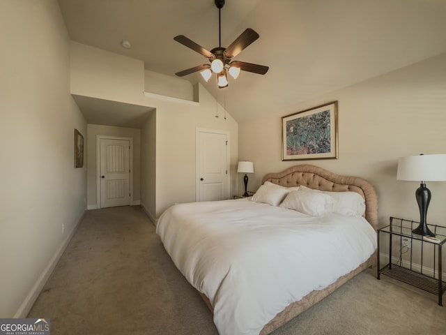 carpeted bedroom featuring baseboards, a ceiling fan, and vaulted ceiling