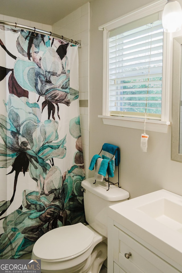 710 Bluebird Dr SE, Conyers, GA 30094 - full bathroom featuring vanity, a shower with curtain, and toilet