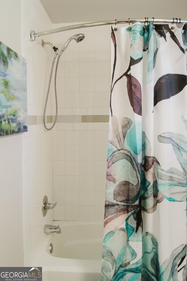 710 Bluebird Dr SE, Conyers, GA 30094 - bathroom featuring shower / bath combo with shower curtain