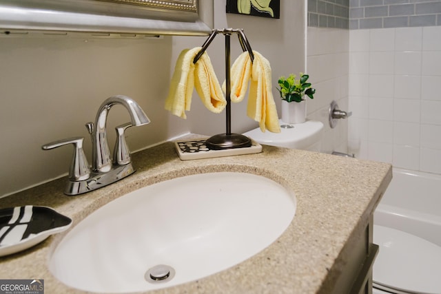 710 Bluebird Dr SE, Conyers, GA 30094 - interior details featuring vanity,  shower combination, and toilet