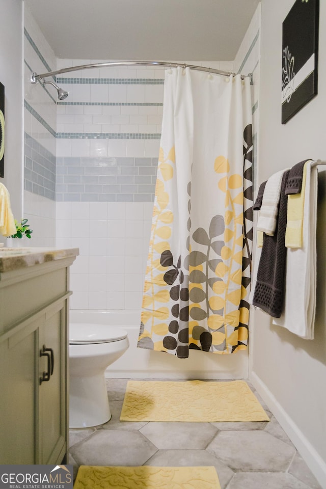 710 Bluebird Dr SE, Conyers, GA 30094 - bathroom with shower / bath combo with shower curtain, toilet, baseboards, and vanity