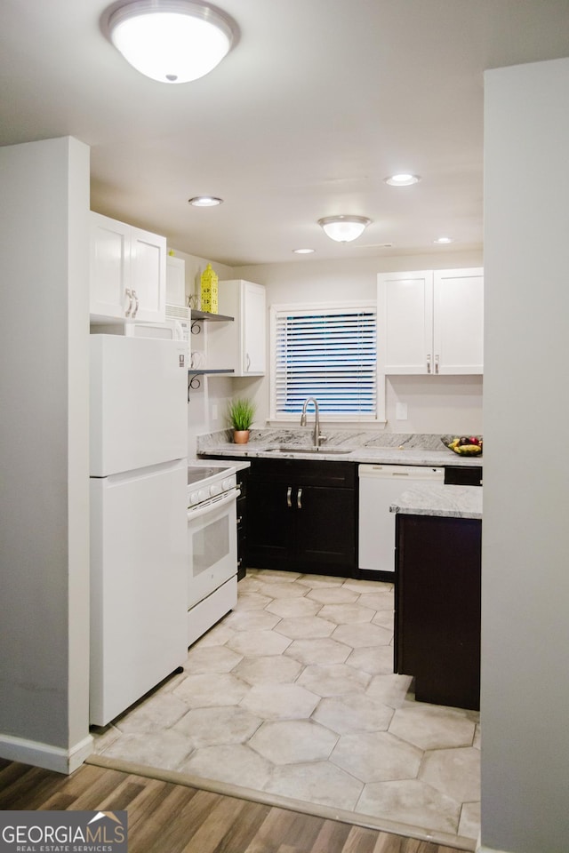 710 Bluebird Dr SE, Conyers, GA 30094 - kitchen featuring white appliances, white cabinetry, open shelves, and a sink