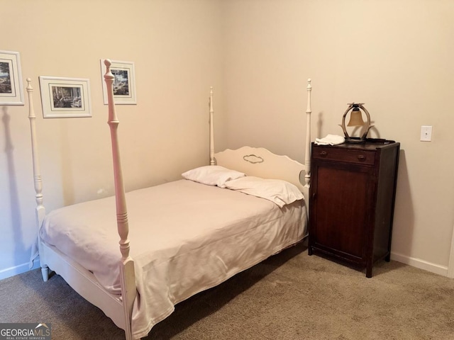 bedroom with baseboards and carpet floors